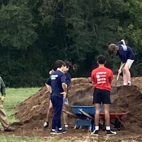 Group shoveling dirt