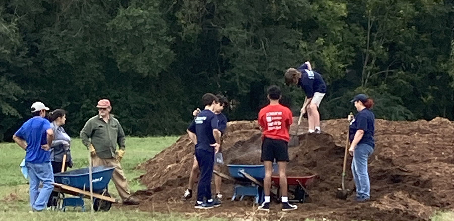 Group shoveling dirt