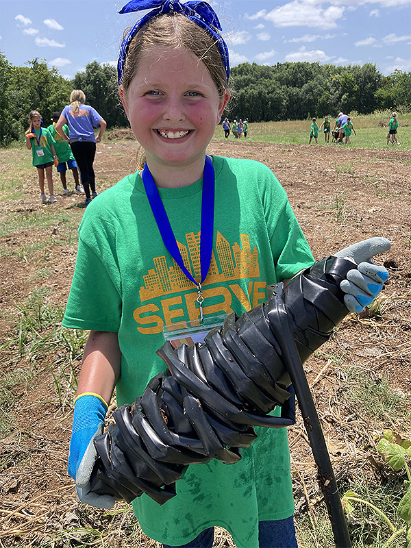 Girl working in community garden